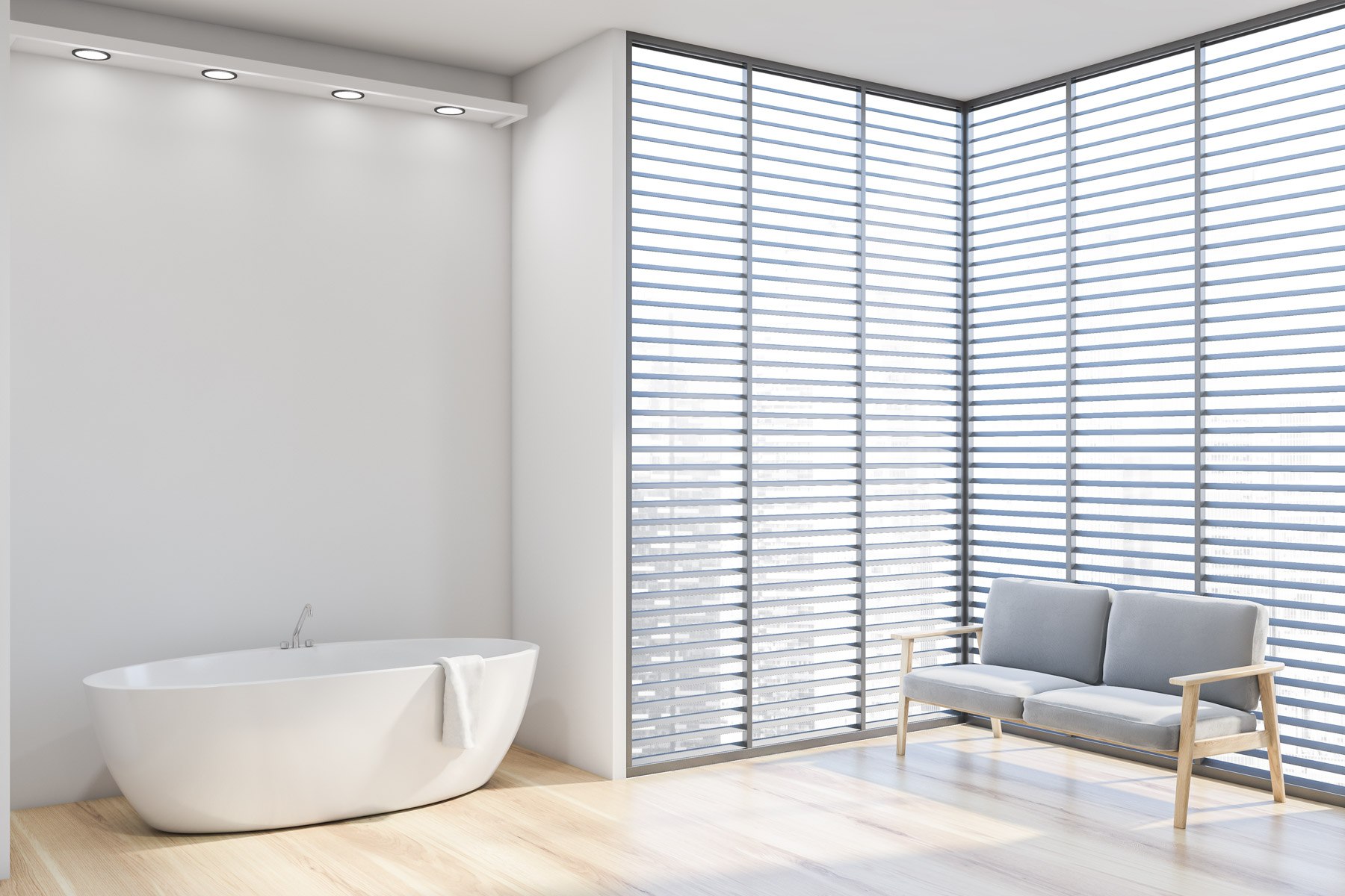 White bathroom corner with tub and sofa